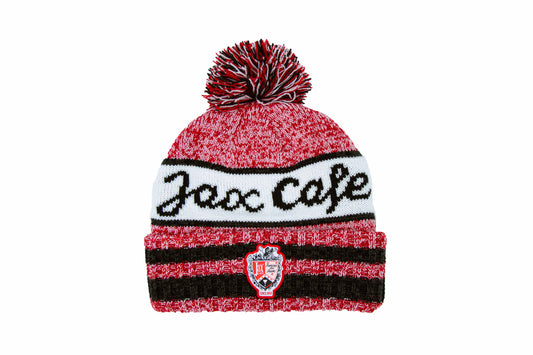 A pom hat with "jax cafe" text written across the hat with the Jax cafe logo below
